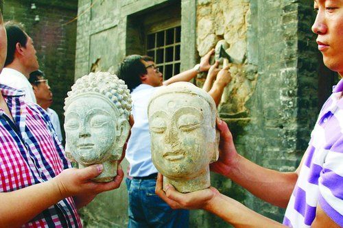 河北邯郸石窟寺墙壁雨后露出三尊“佛首”(图)